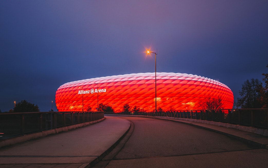 Allianz Arena illuminated at night in Munich, Germany.