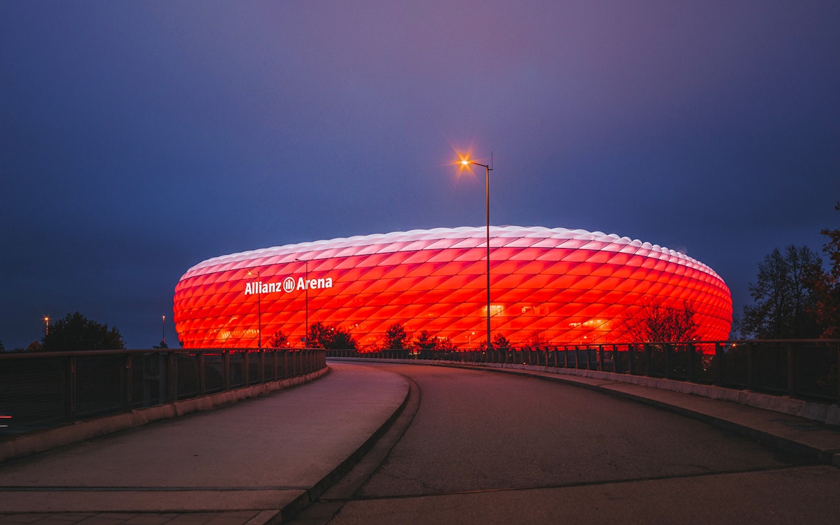 Allianz Arena illuminated at night in Munich, Germany.
