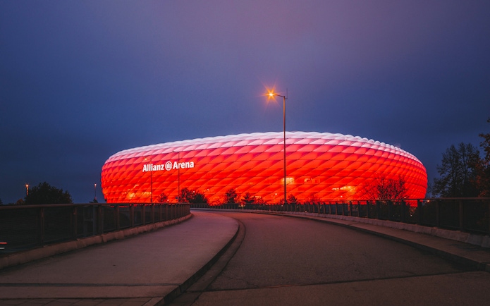 Allianz Arena illuminated at night in Munich, Germany.