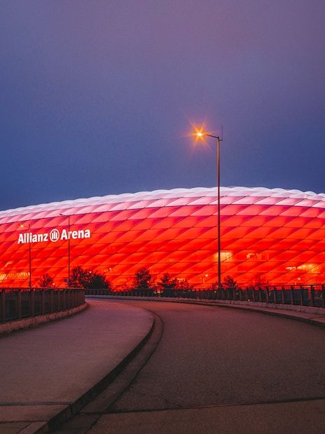 Allianz Arena illuminated at night in Munich, Germany.