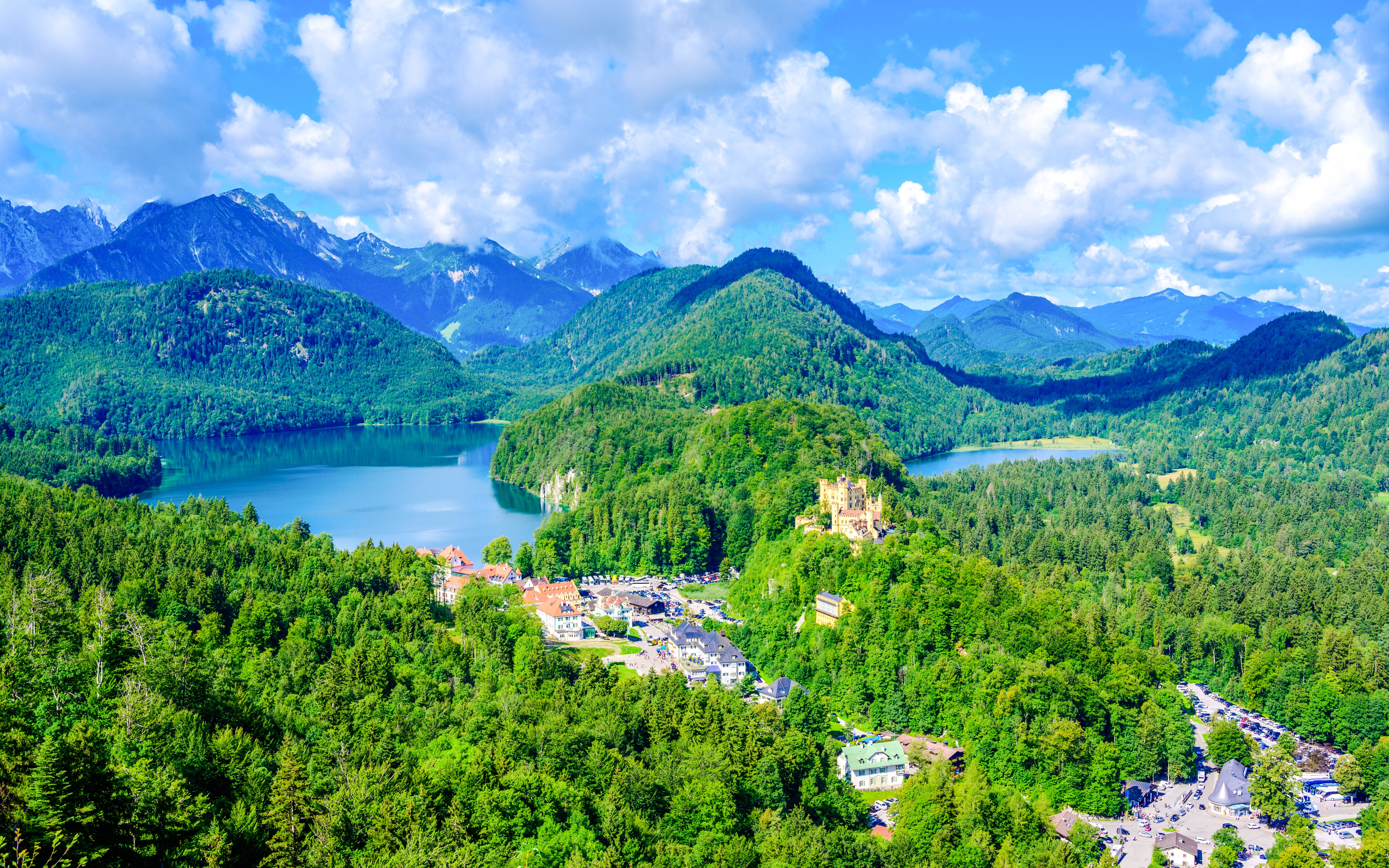 Schwangau Village with Hohenschwangau Castle and Alpine lakes in the background.
