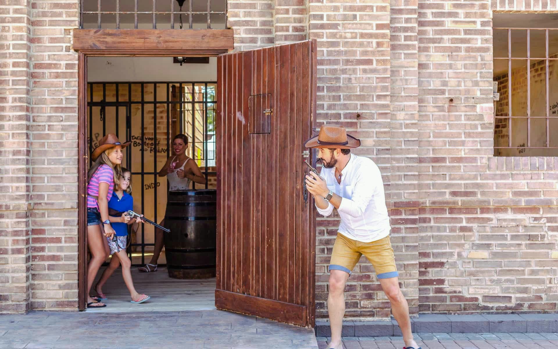 Cowboy-themed shootout scene at Western Water Park Mallorca.