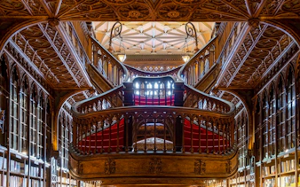 Lello Bookstore's ornate staircase in Porto, part of the Lello Bookstore Ticket + Douro River Cruise tour.