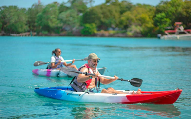 Kayakers paddling near IslaBela in the Rosario Islands, Colombia.