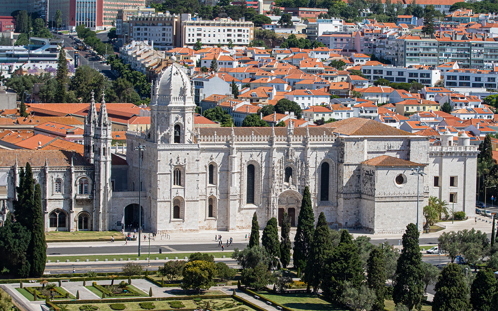 Jerónimos Monastery in Lisbon with surrounding gardens and cityscape.