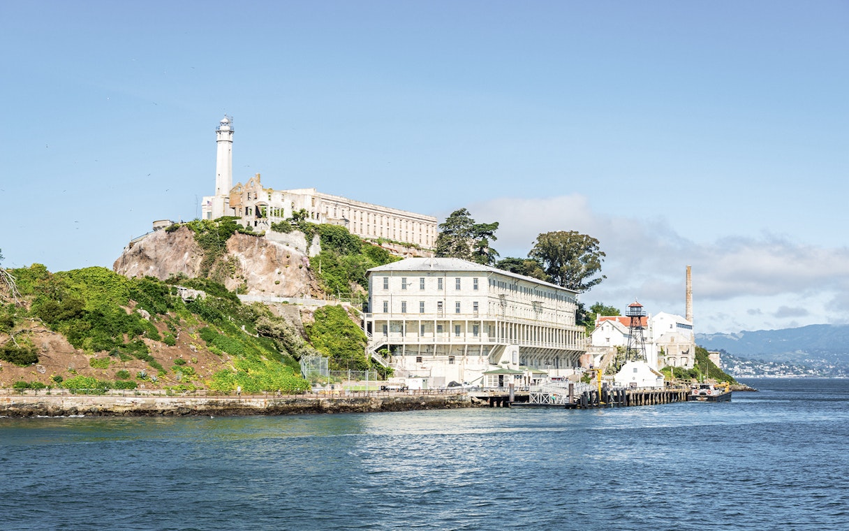 Alcatraz Island with historic prison buildings viewed from San Francisco Bay.