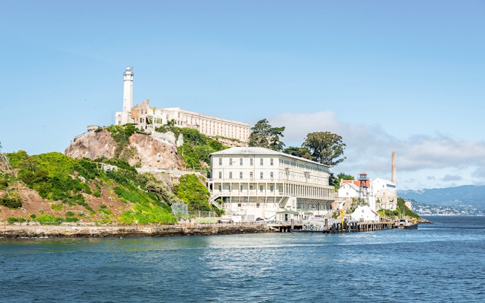 Alcatraz Island with historic prison buildings viewed from San Francisco Bay.