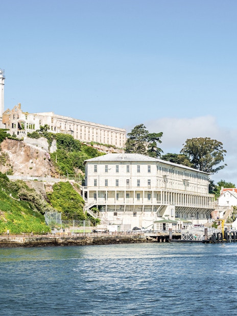 Alcatraz Island with historic prison buildings viewed from San Francisco Bay.