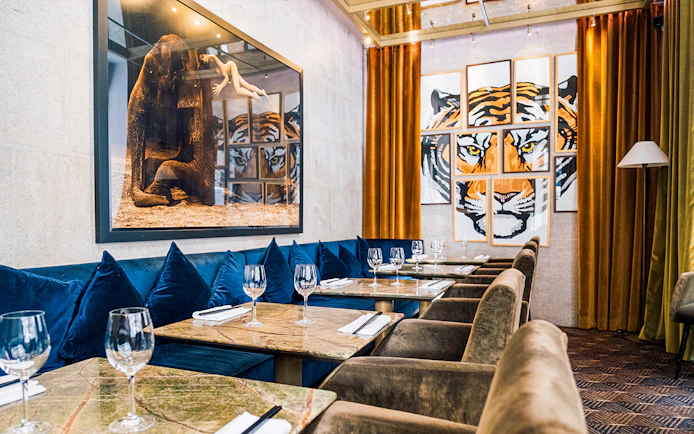Dining area with art decor at Crazy Horse Paris Show and Dinner.