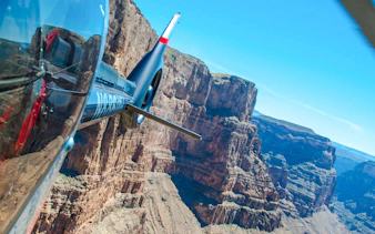 Helicopter flying over Grand Canyon West during Las Vegas tour with canyon landing.