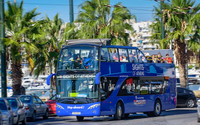 Open-top bus touring Athens with views of the Acropolis, Piraeus, and nearby beaches.