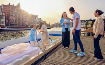 Guests enjoying the Cloud Boat Cruise in Amsterdam canal.