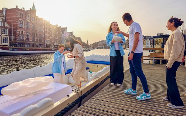 Guests enjoying the Cloud Boat Cruise in Amsterdam canal.