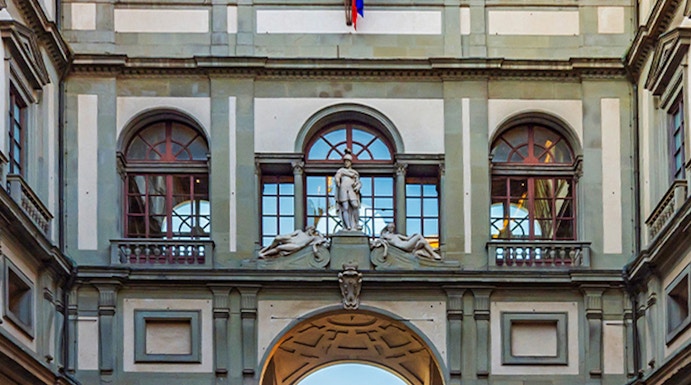 Uffizi Gallery courtyard with statues and arches, Florence, Italy.