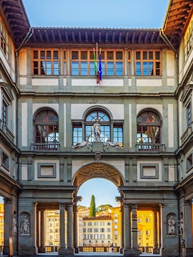Uffizi Gallery courtyard with statues and arches, Florence, Italy.