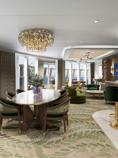 Concierge Royal Suite with oceanview verandah on Disney Adventure Cruise, featuring elegant dining area and lounge.