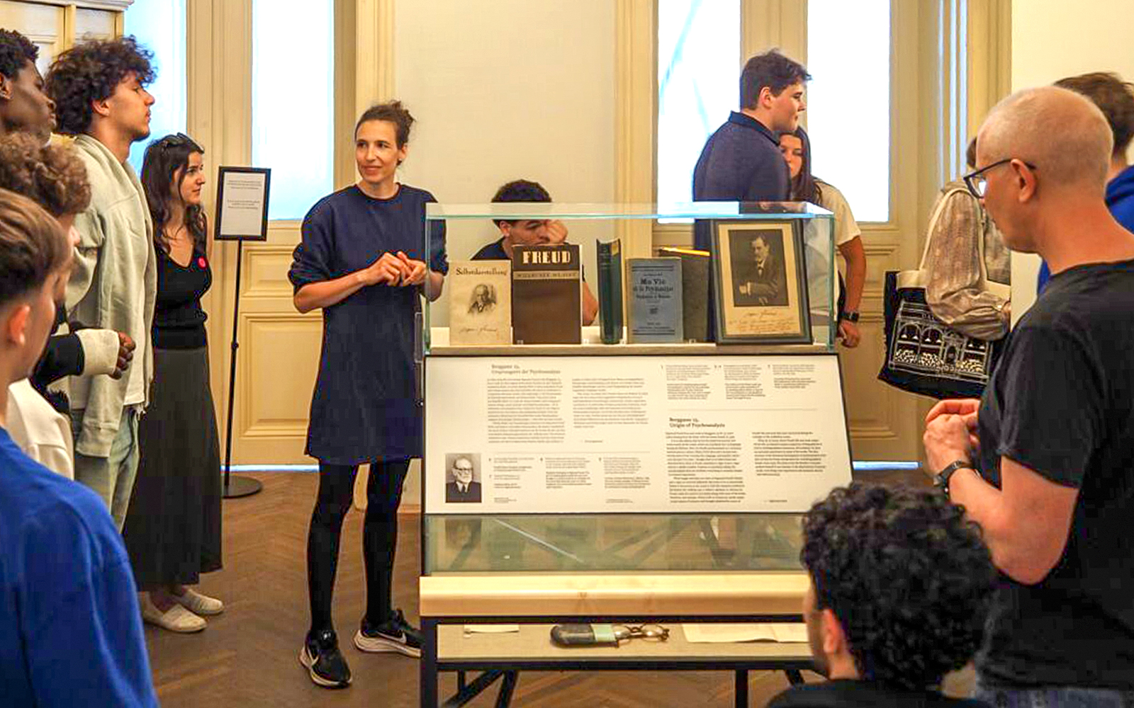 Tour group with female guide at Sigmund Freud Museum, Vienna, Austria.