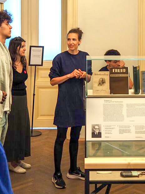 Tour group with female guide at Sigmund Freud Museum, Vienna, Austria.