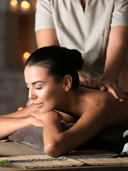 Young woman enjoying a massage at Diora Spa.