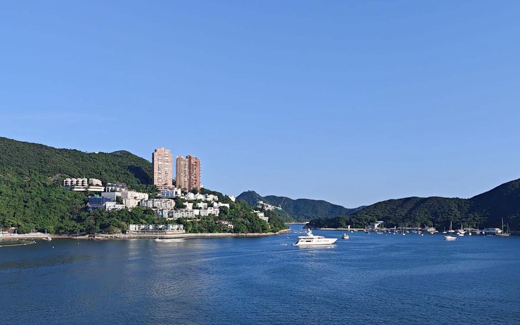 Coastal view with yachts and hillside buildings on Big Bus Hop-On Hop-Off Tour.