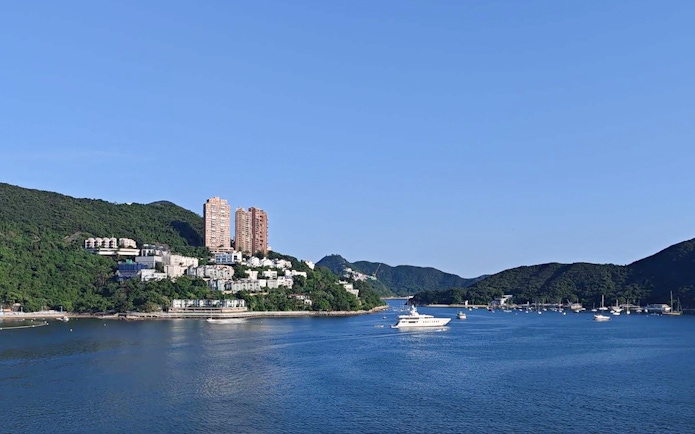 Coastal view with yachts and hillside buildings on Big Bus Hop-On Hop-Off Tour.