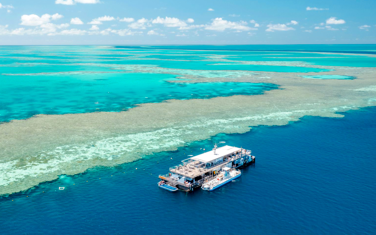 Pontoon floating on the Great Barrier Reef's turquoise waters, Australia.