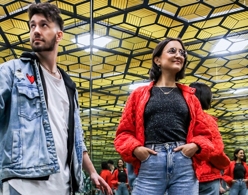 Visitors exploring interactive exhibits at the Museum of Illusions in Madrid.