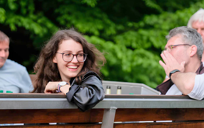 Guests enjoying Auwald scenery during motorboat tour in Leipzig.