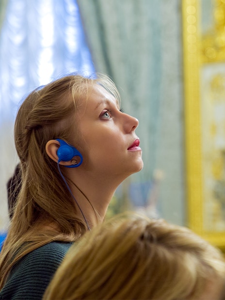 Visitor with audio guide exploring Moco Museum, Barcelona.
