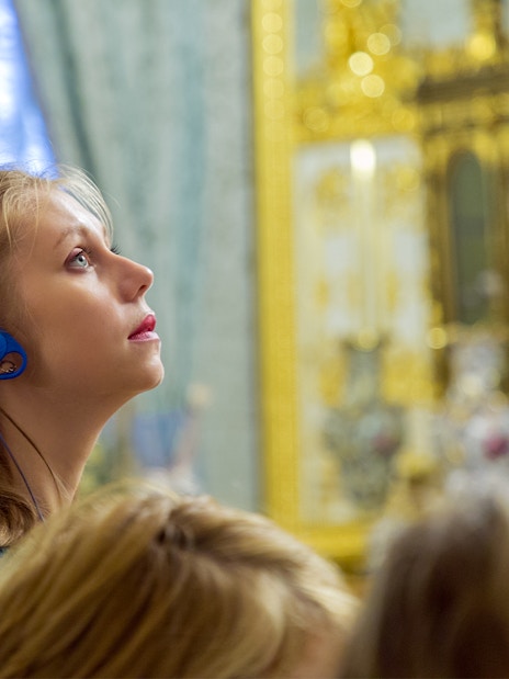 Visitor with audio guide exploring Moco Museum, Barcelona.