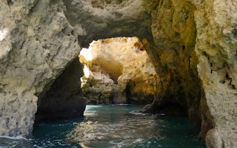 Caves of Ponta da Piedade with turquoise water on a private cruise in Lagos, Portugal.