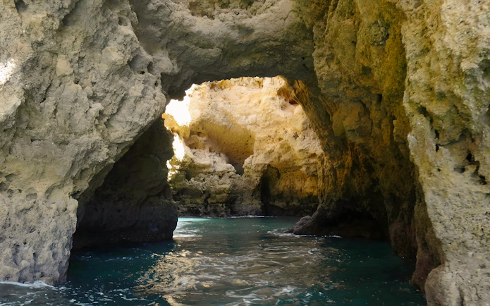 Caves of Ponta da Piedade with turquoise water on a private cruise in Lagos, Portugal.