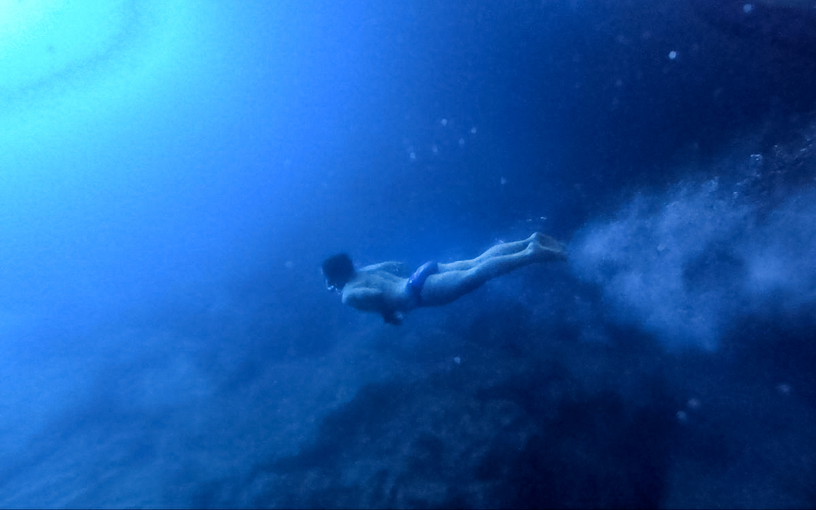 Guests swimming in the blue caves of Kotor, Montenegro.
