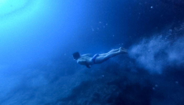 Guests swimming in the blue caves of Kotor, Montenegro.