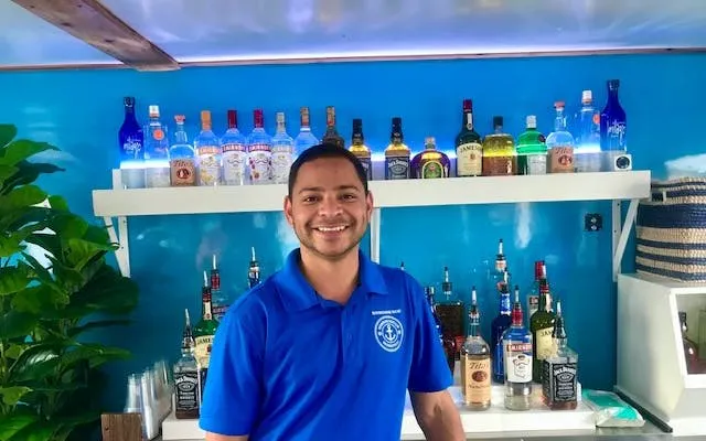 Bartender on Boomerang Sightseeing Cruise with Potomac River views in Washington, DC.