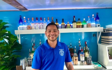 Bartender on Boomerang Sightseeing Cruise with Potomac River views in Washington, DC.
