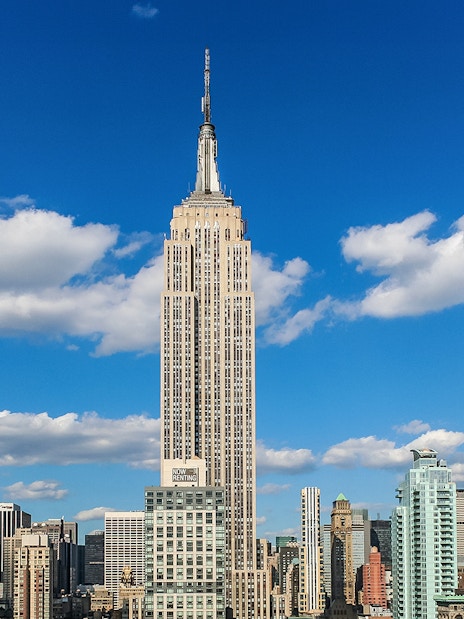 Empire State Building against a blue sky in New York City.