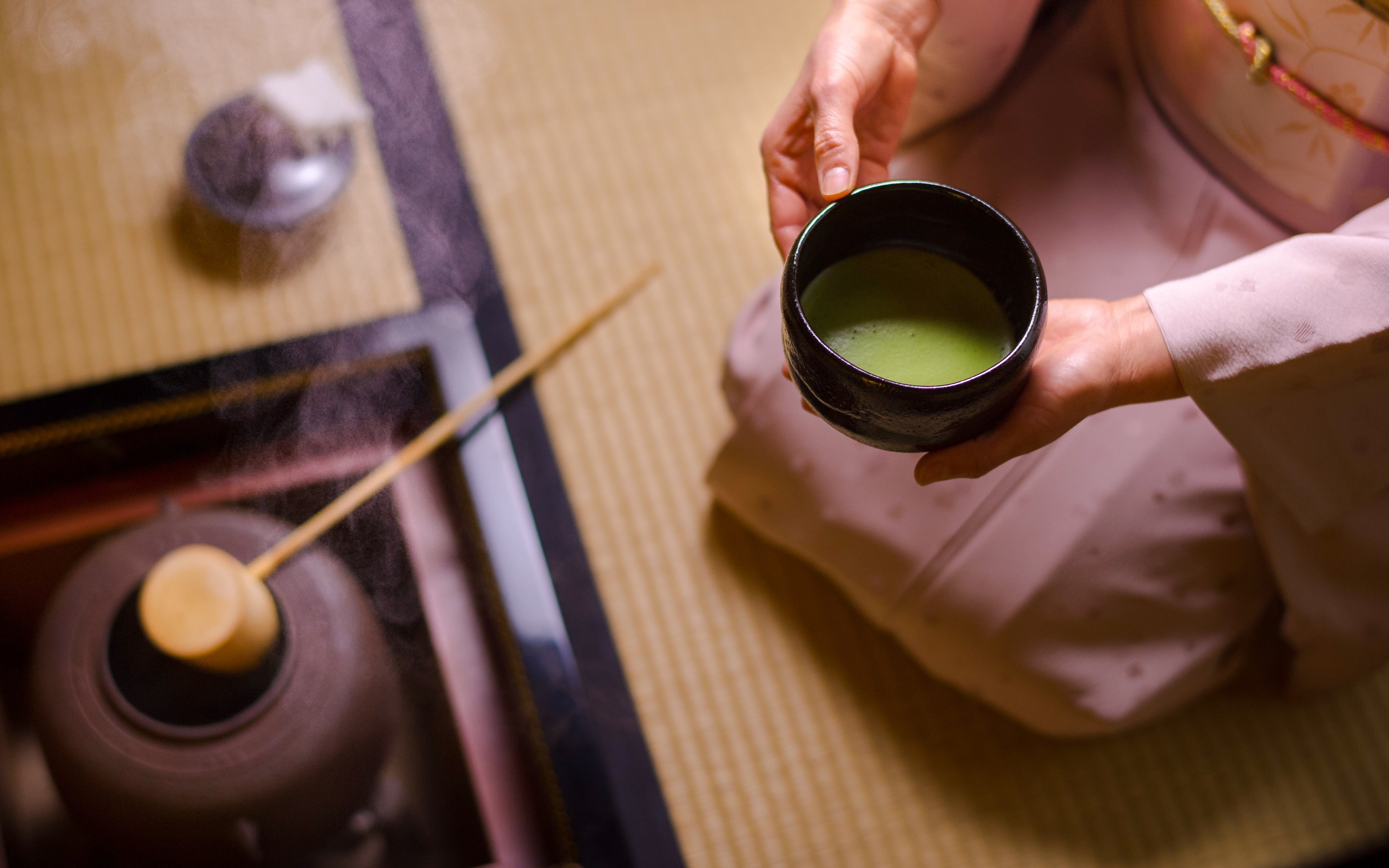 Preparing matcha tea in a traditional Japanese setting in Tokyo.