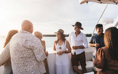 Group enjoying Darwin Harbour lunch cruise on a boat.