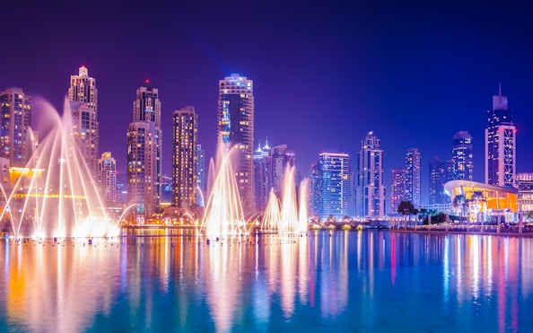 Dancing water fountain show with Dubai skyline during 2-hour luxury dhow dinner cruise.