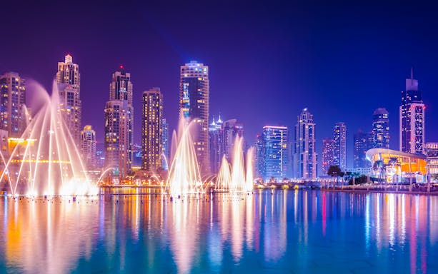 Dancing water fountain show with Dubai skyline during 2-hour luxury dhow dinner cruise.