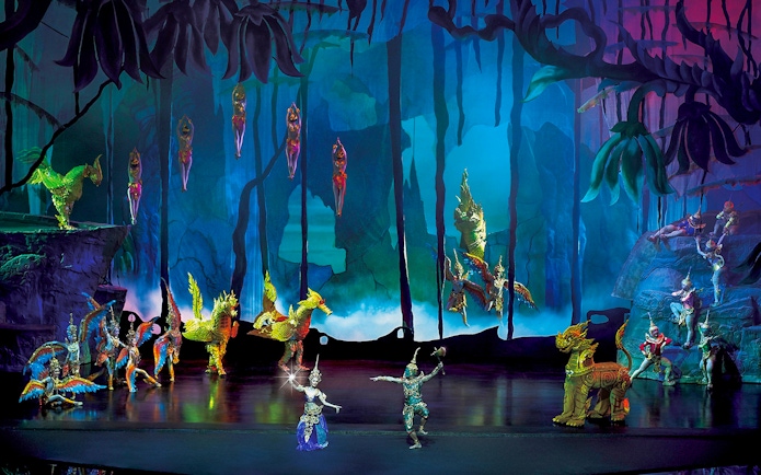 Performers in traditional costumes on stage at Siam Niramit Phuket show.