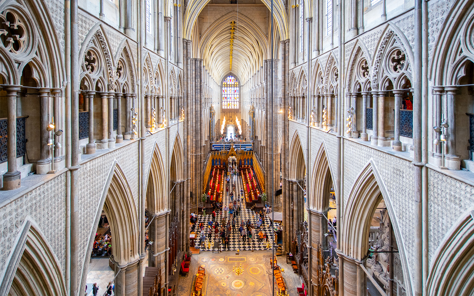 Westminster Abbey interior view with Anglican Church architecture and stained glass.
