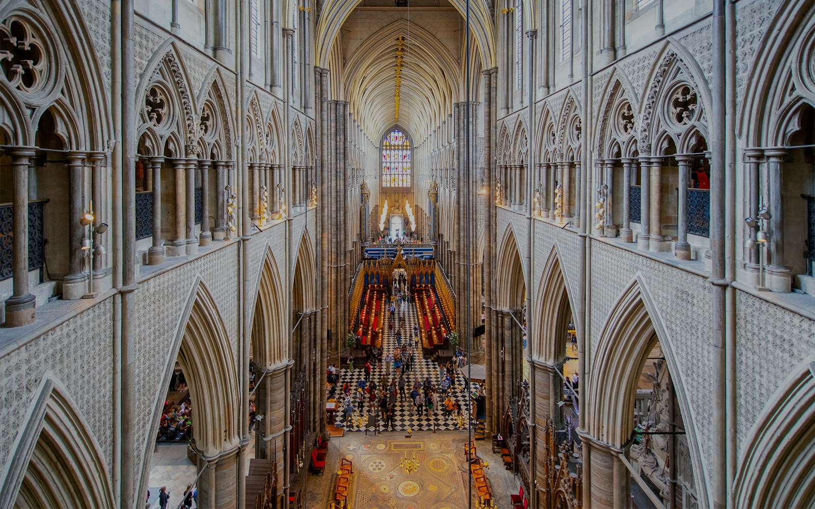 Westminster Abbey interior view with Anglican Church architecture and stained glass.