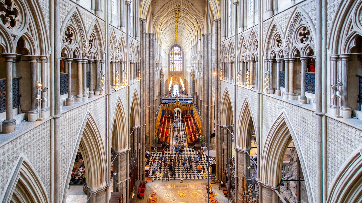 Westminster Abbey interior view with Anglican Church architecture and stained glass.