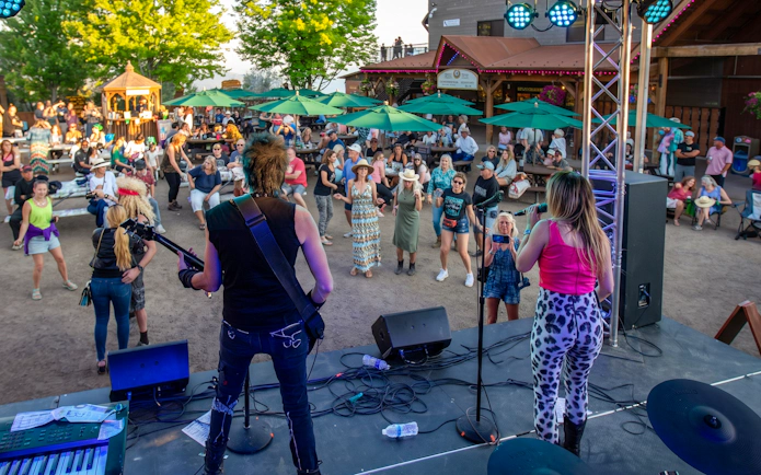 Live band performing at Glenwood Caverns Adventure Park with audience dancing.