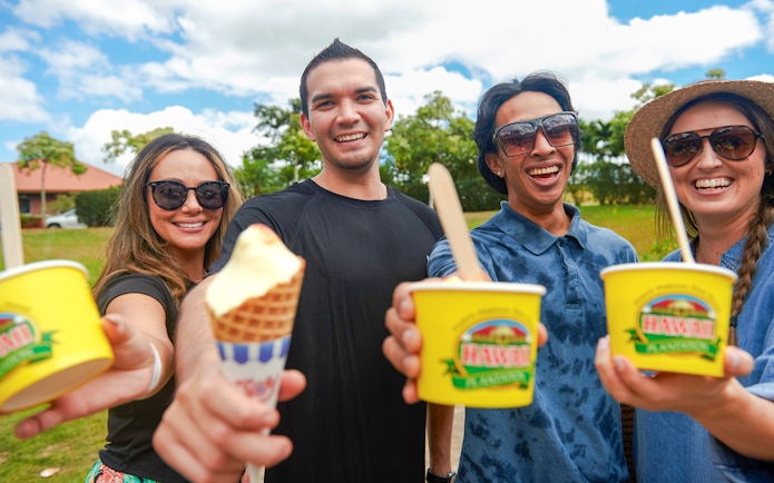 Friends enjoying ice cream during Oahu's Grand Circle tour.