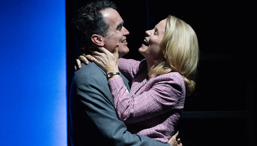 Couple embracing on stage during "Days of Wine and Roses" performance.