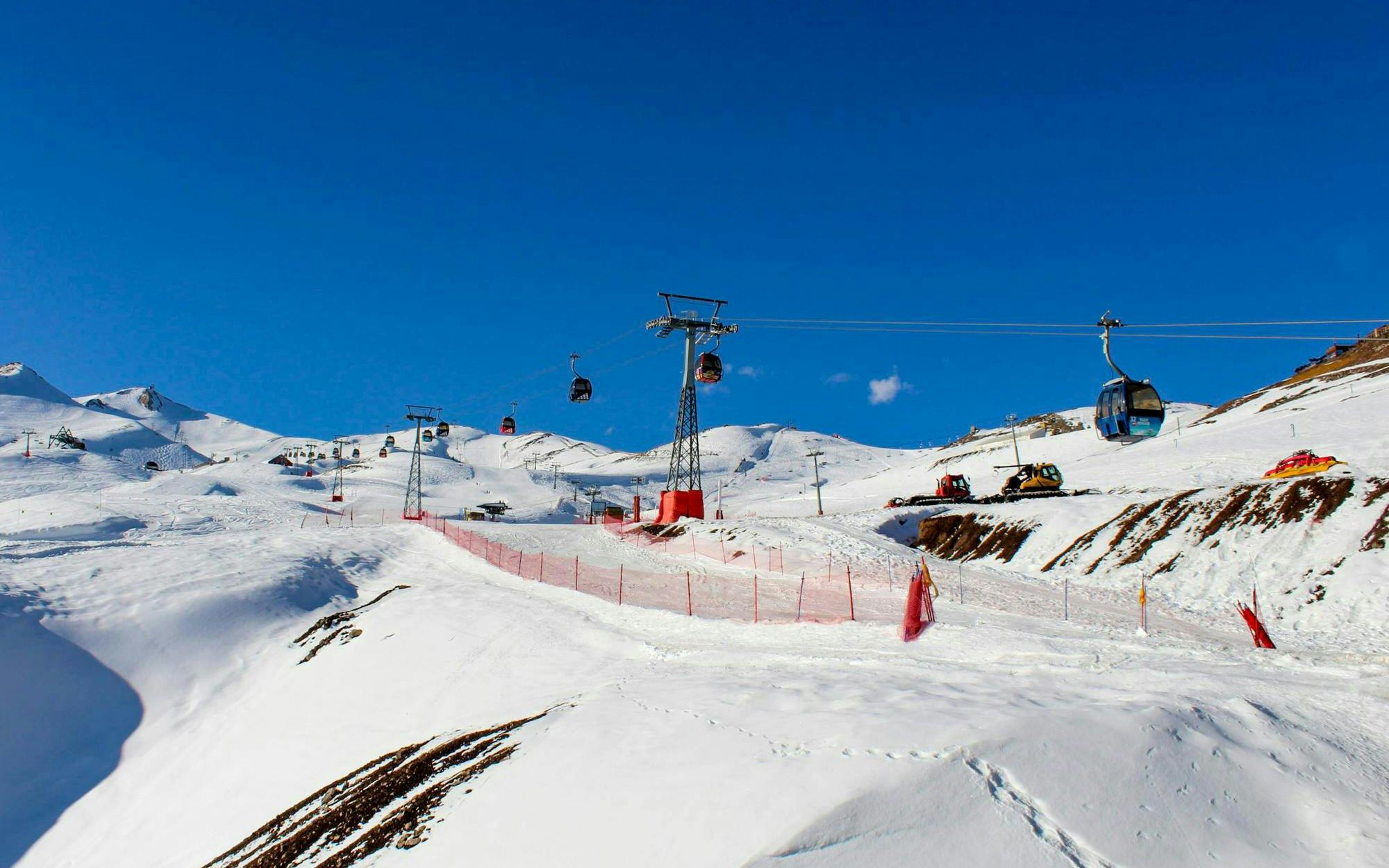 Ski lifts and snowy slopes at Valle Nevado ski resort in the Andes Mountains, Chile.