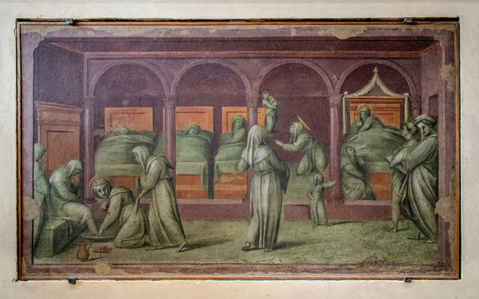 Hospital scene painting in Gallerie dell'Accademia, Venice, depicting caregivers attending to patients.